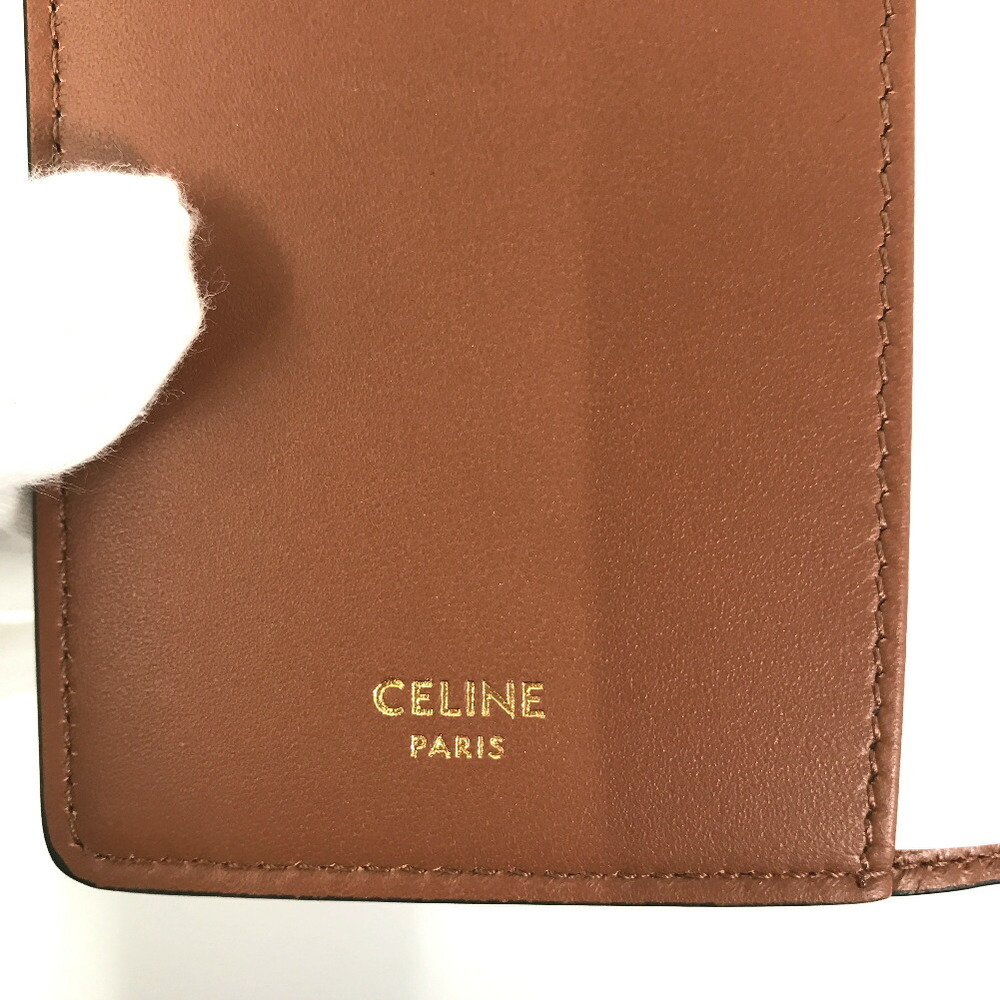 MEDIUM NOTEBOOK COVER IN TRIOMPHE CANVAS AND CALFSKIN - TAN