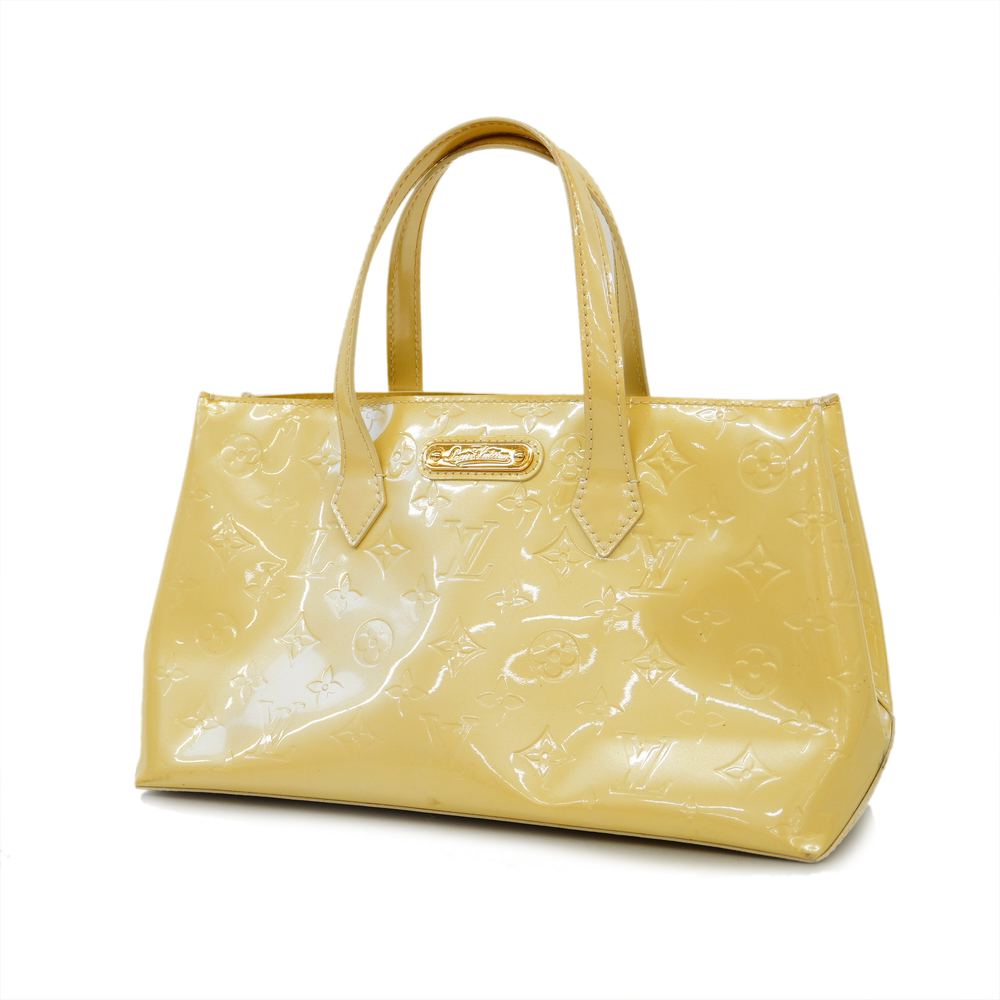 Wilshire PM Top handle bag in Monogram Vernis leather, Gold Hardware