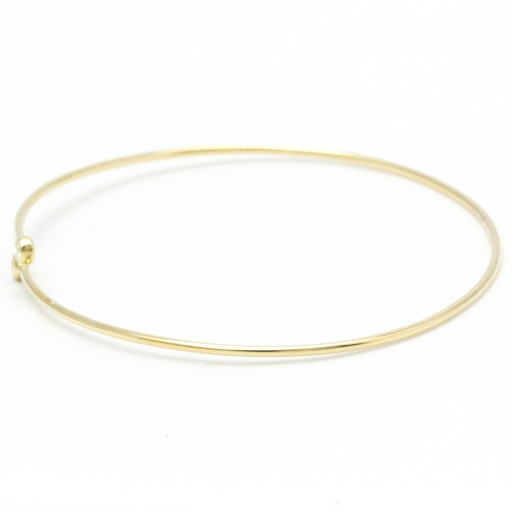 Elsa Peretti™ Diamond Hoop single-row bangle in 18k gold with