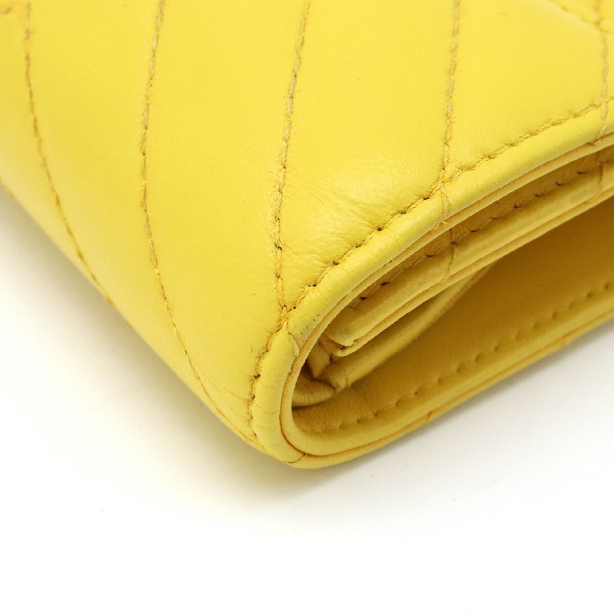 CHANEL Chevron V-stitch Coco Mark Tri-fold Wallet Leather Yellow A81900