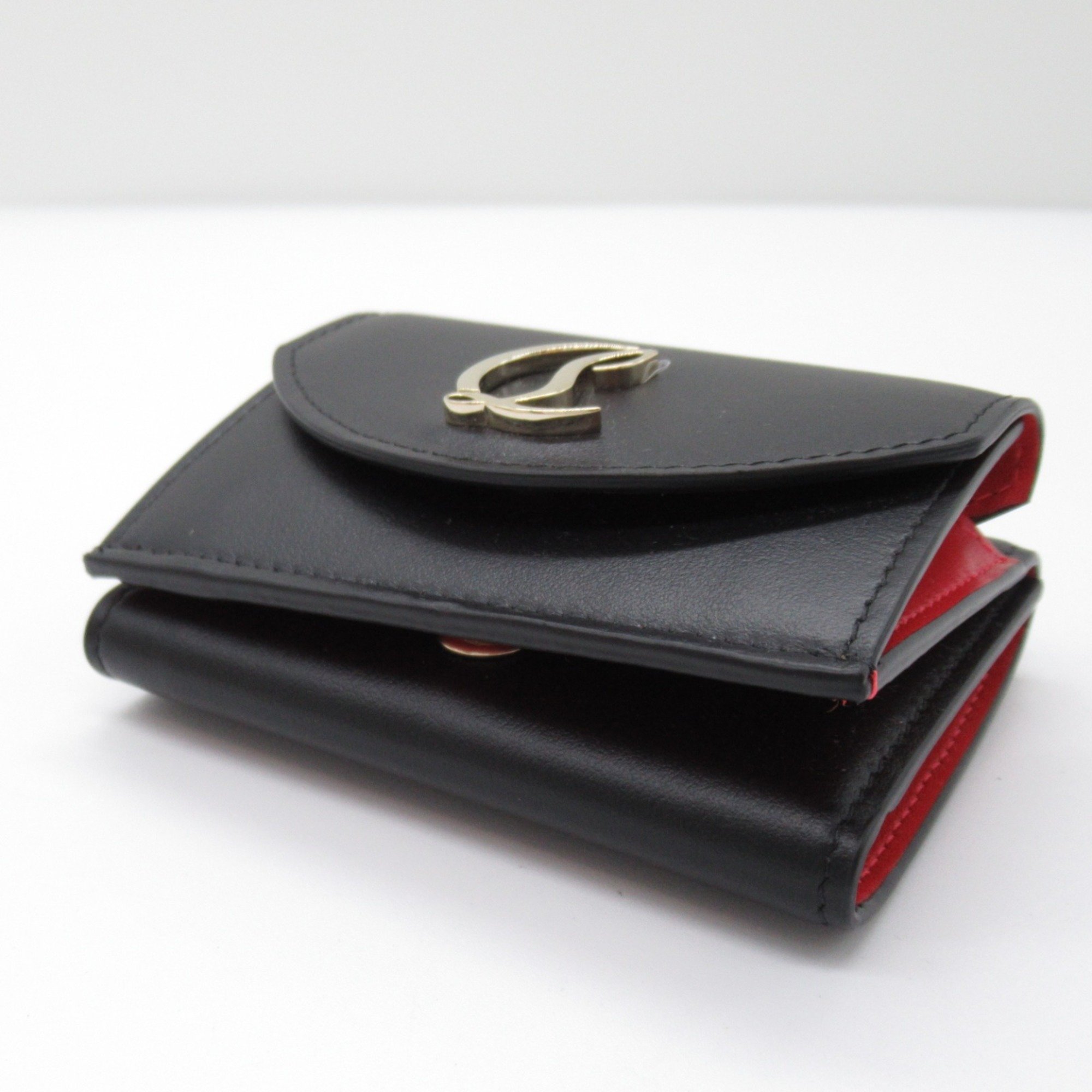 Christian Louboutin Tri-fold wallet Black/Gold leather 3235108CM6S